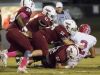 Quarterback Damean Bivins (2) is taken down by the Tate defense during the Pace vs Tate football game at Tate High School on Friday, October 7, 2016.