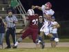 Quarterback Damean Bivins (2) leaps as he gets rid of the ball before Caleb Campell (33) reaches him during the Pace vs Tate football game at Tate High School on Friday, October 7, 2016.