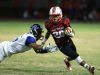 Palm Springs High School's Nick Reyes Foster evades a tackle by Cathedral City High School'during their game at Palm Springs.