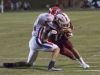 Scott Marshman (21) takes down Rodriquez Smith (11) along the sideline during the Pace vs Tate football game at Tate High School on Friday, October 7, 2016.