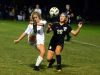 Hendersonville High junior Haley Stevens flicks the ball behind her over Station Camp sophomore Katie Koumiss during first-half action. Stevens scored the game-winning penalty kick in the shootout.