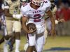 Pace quarterback, Damean Bivins, (No. 2) looks for a hole in the line of scrimmage after being forced out of the pocket by the Gulf Breeze defense during Friday night's District-2 6A game.