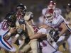 Gulf Breeze running back, Tyler Dittmer, (No. 36) gets wrapped by the Pace defense during Friday night's District-2 6A game.