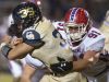 Pace High School defensive lineman, Bailey Clark, (No. 91) gets way with an uncalled face mask tackle on Gulf Breeze High School running back, Tyler Dittmer, (No. 36) during Friday night's District-2 6A game.