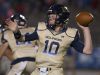 Gulf Breeze quarterback, Tyler Phelps, (No. 10) sends the football down field to an open to a receiver during Friday night's District-2 6A game.