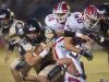 Gulf Breeze running back, Tyler Dittmer, (No. 36) gets wrapped by the Pace defense during Friday night's District-2 6A game.