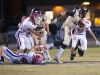 Gulf Breeze quarterback, Tyler Phelps, (No. 10) slips out of the clutches of the Pace defense during Friday night's District-2 6A game.
