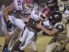 Pace running back, Anthony Johnson, Jr. (No. 32) gets gang tackled by the Gulf Breeze defense during Friday night's District-26a game.