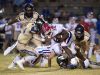 The Gulf Breeze High defense shuts down Pace High School running back, Anthony Johnson, Jr., (No. 32) during Friday night's District-2 6A game.