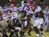 The Gulf Breeze High defense shuts down Pace High School running back, Anthony Johnson, Jr., (No. 32) during Friday night's District-2 6A game.