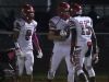 Nrot Fort Myers' Bryce Adkins celebrates with teammates, Errick Harris and Luis Alfonso after he scored as North Fort Myers played at Charlotte Friday night.