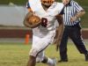 Escambia running back Queven Dosunma (8) looks up field after taking a handoff Friday night at Tate High School.