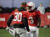 Center Grove's Titus McCoy (30) cheers on teammate Russ Yeast (3) after Yeast scored one of his five TDs vs. Cathedral on Friday.