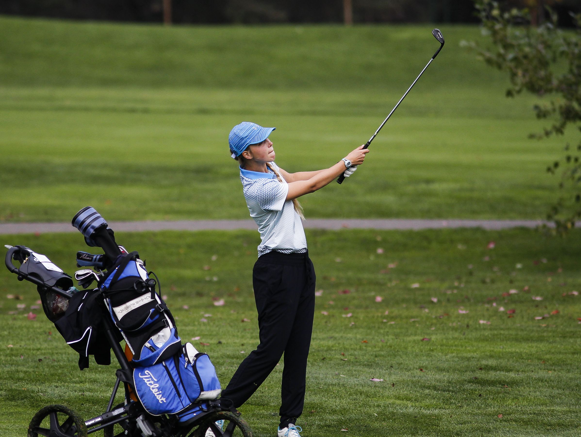 Grace Castle of Lansing Catholic works the fairway on the second hole during the Div. 4 Girls Golf Finals October 15, 2016, at Forest Akers West at Michigan State University.