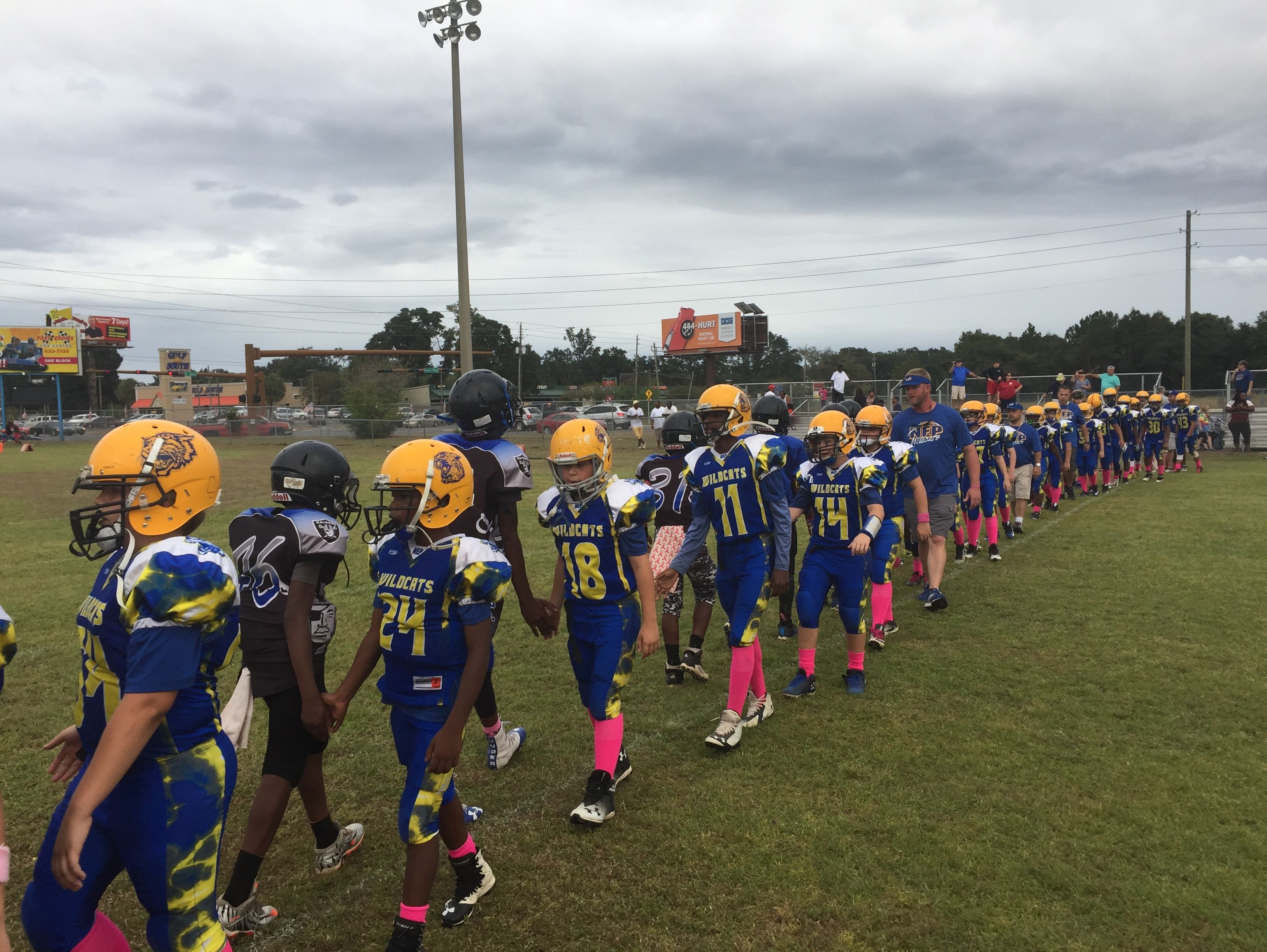 Members of the NEP Wildcats and Brent Raiders shake hands after Saturday's game at Brent.