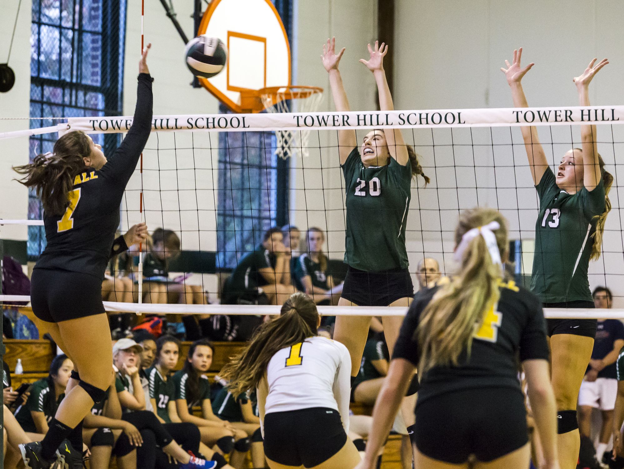 Tatnall's Mackenzie Prettyman (No. 7) hits the ball over the net as Tower Hill's Marie Freebery (No. 20) and Kyra Caffrey (No. 13) leap for a block in the third game of Tower Hill's 3-0 win over Tatnall at Tower Hill School in Wilmington on Tuesday afternoon.