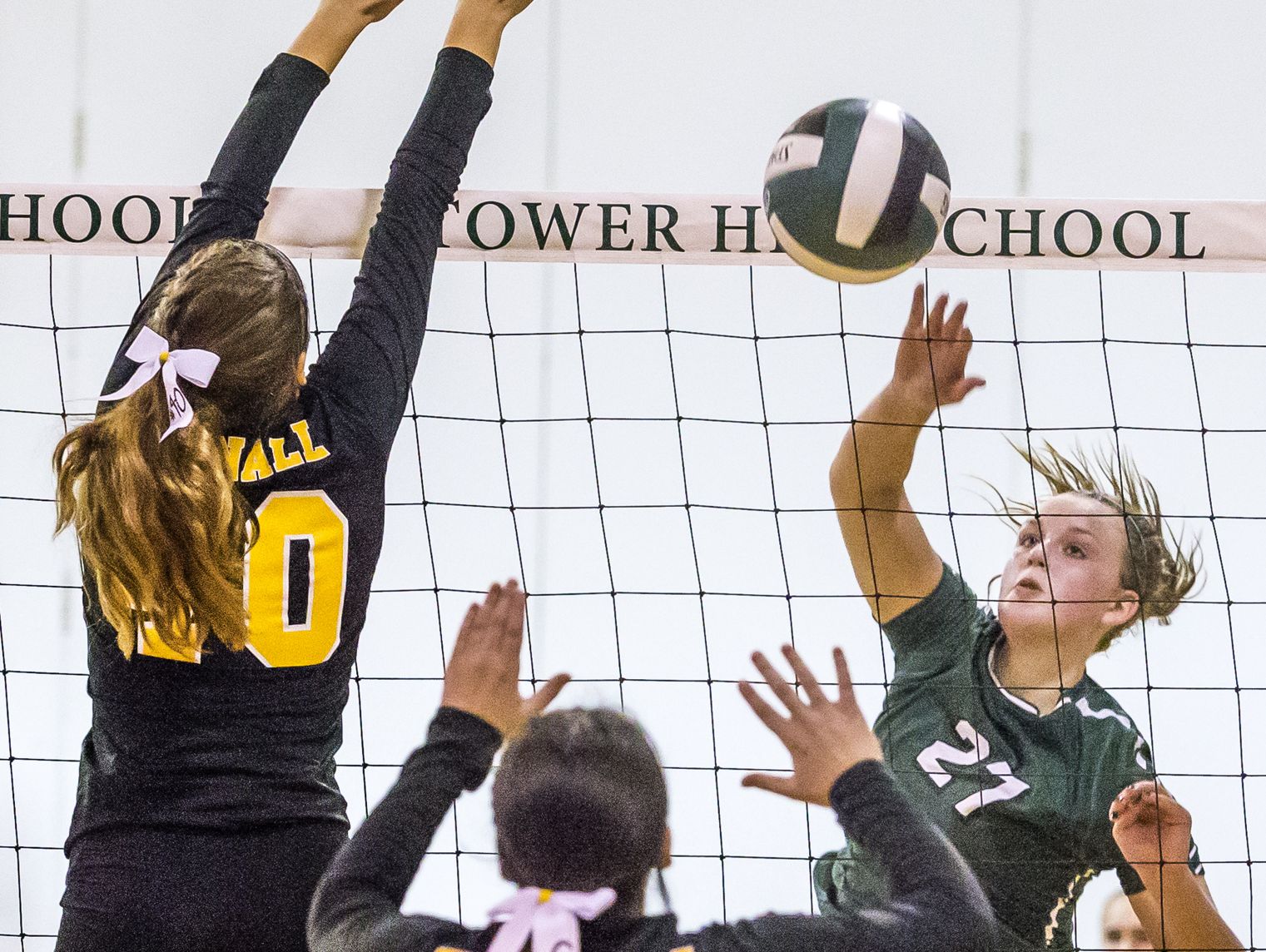 Tower Hill's Alexandra Thomson (No. 27) puts the ball past the block of Tatnall's Catherine Marvin (No. 40) in the third game of Tower Hill's 3-0 win over Tatnall at Tower Hill School in Wilmington on Tuesday afternoon.