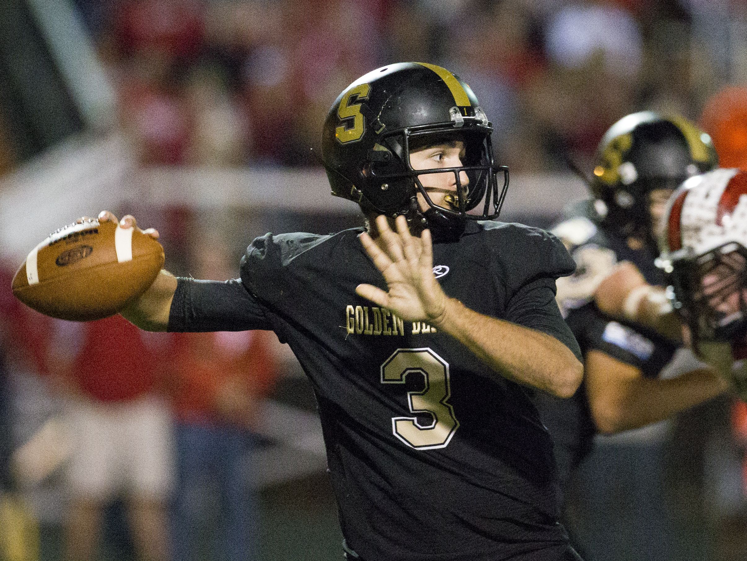 John Lux, quarterback for Shelbyville, throws during second quarter action, New Palestine High School at Shelbyville High School in a battle of unbeatens, Shelbyville, Friday, Sept. 30, 2016.