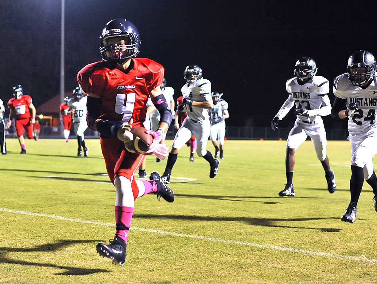 Creek Wood's Tanner Corlew races to the end zone during the Red Hawks 27-16 win over Loretto.