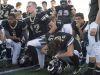 Jackson Schoor hangs his head as the Fort Collins High School football team gathers following a 54-38 loss to Skyline at French Field Friday.