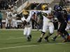 Demarcus McCall (24) for the Captain Shreve Gators rushes around the Southwood Cowboys defense on Friday night at Lee Hedges Stadium in Shreveport.