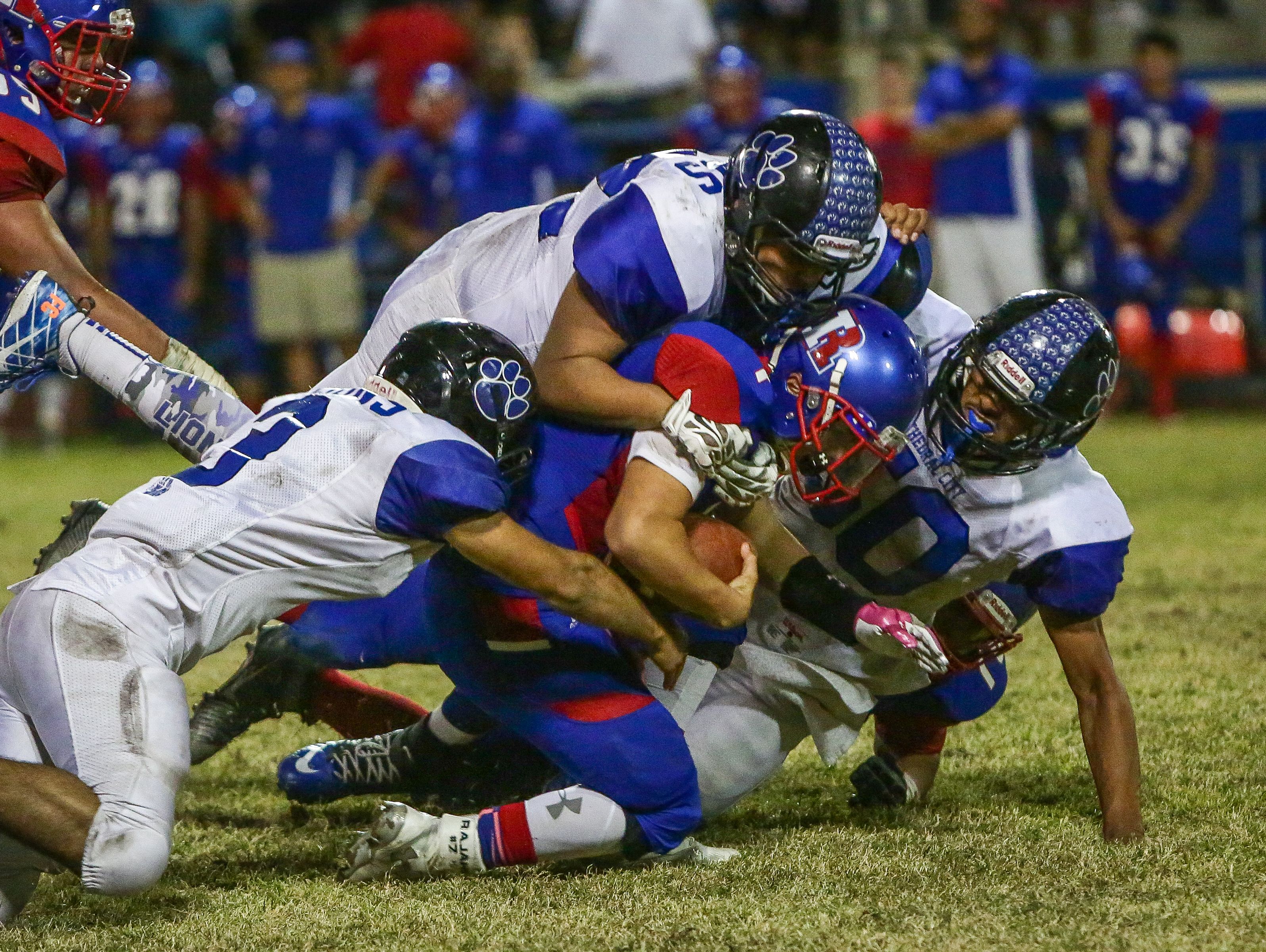 Aubuchon Martinez stopped in the middle for a loss against the Cathedral City defense.