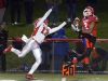 Fairport's Beeshawn Curry, right, tries to haul in this pass while being defended by Hilton's Joseph Sach during a regular-season game. The third-seeded Red Raiders face No. 3 Pittsford in the Section V Class AA semifinals at 4 p.m. Sunday at Rhinos Stadium.