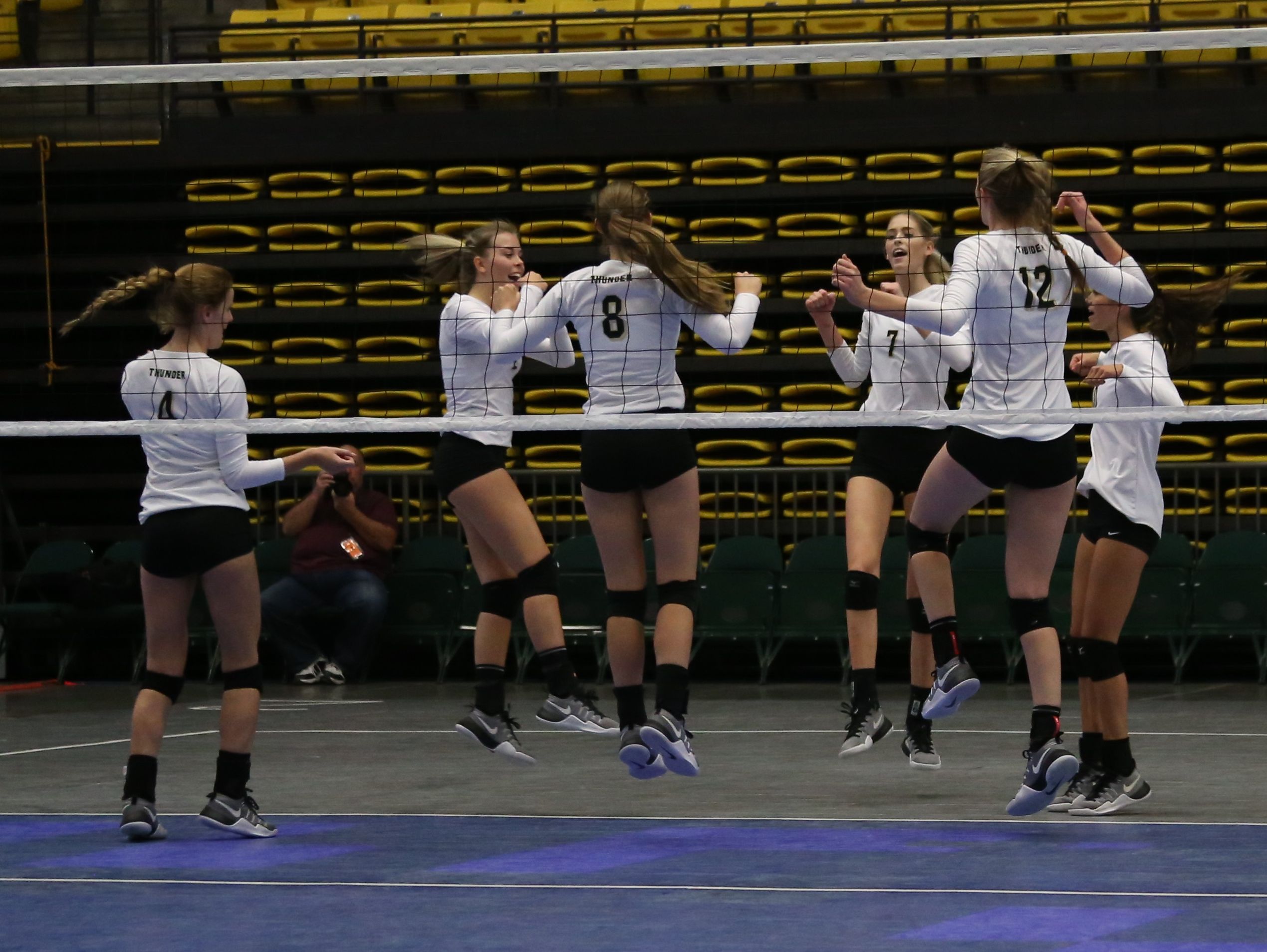 Desert Hills volleyball players celebrate at the 3A State tournament at UVU Wednesday, October 26, 2016.