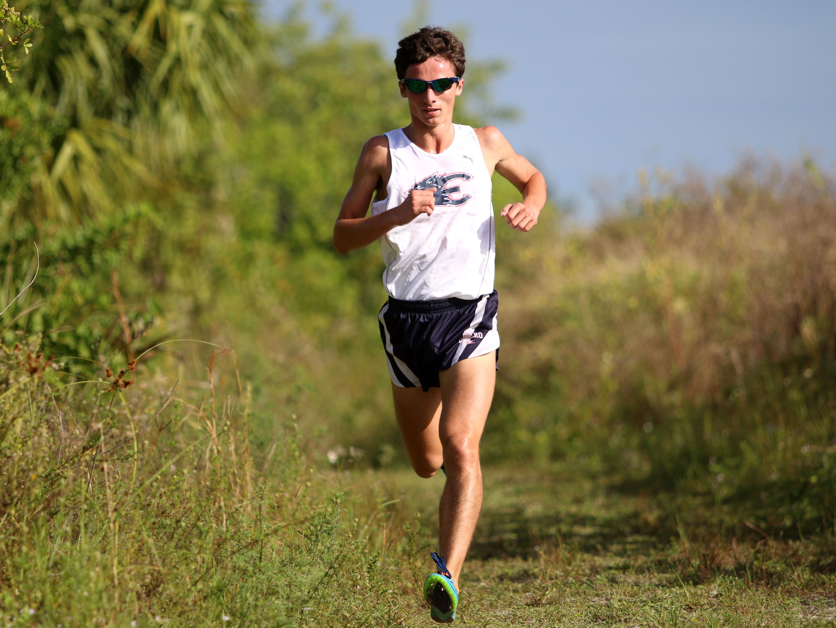 Estero senior Arye Beck holds on the a first place lead during Thursday morning's District 3A-12 meet at Palmetto Ridge High School in Naples, Florida.