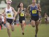 From left, Hugh Brittenham, Estero High School, Ethan Geiger, Robinson High School, and James Hasell, East Lake High School sprint to the finish line during the FHSAA 3A Region district championships at Estero Community Park.