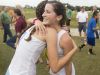 Fort Myers High School x-country runner Krissy Gear gets a hug from a competitor after winning the FHSAA 3A District finals at Estero Community Park on Friday. The Fort Myers High School girls also won the over all title.