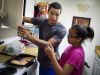 Shawn Murphy talks with his sister Alayna Hancock, 11, while cooking dinner for the family at their home, Tuesday, Oct. 25, 2016, in Nashville, Tenn.