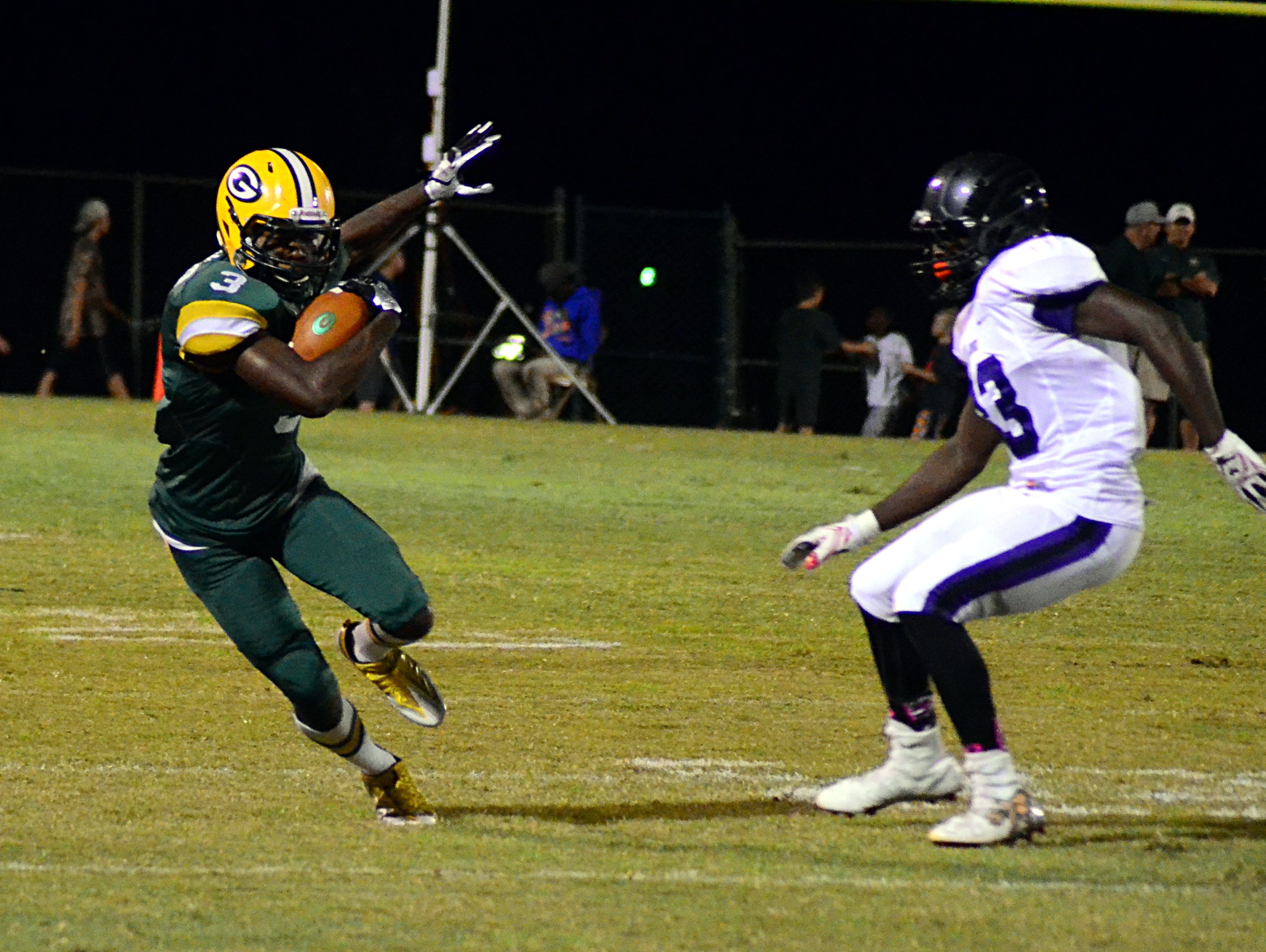 Gallatin High senior Marcus DeVault cuts away from a Cane Ridge defender during first-quarter action.