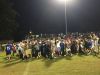 Pace players and fans celebrate after a 35-34 overtime victory Friday at Milton.