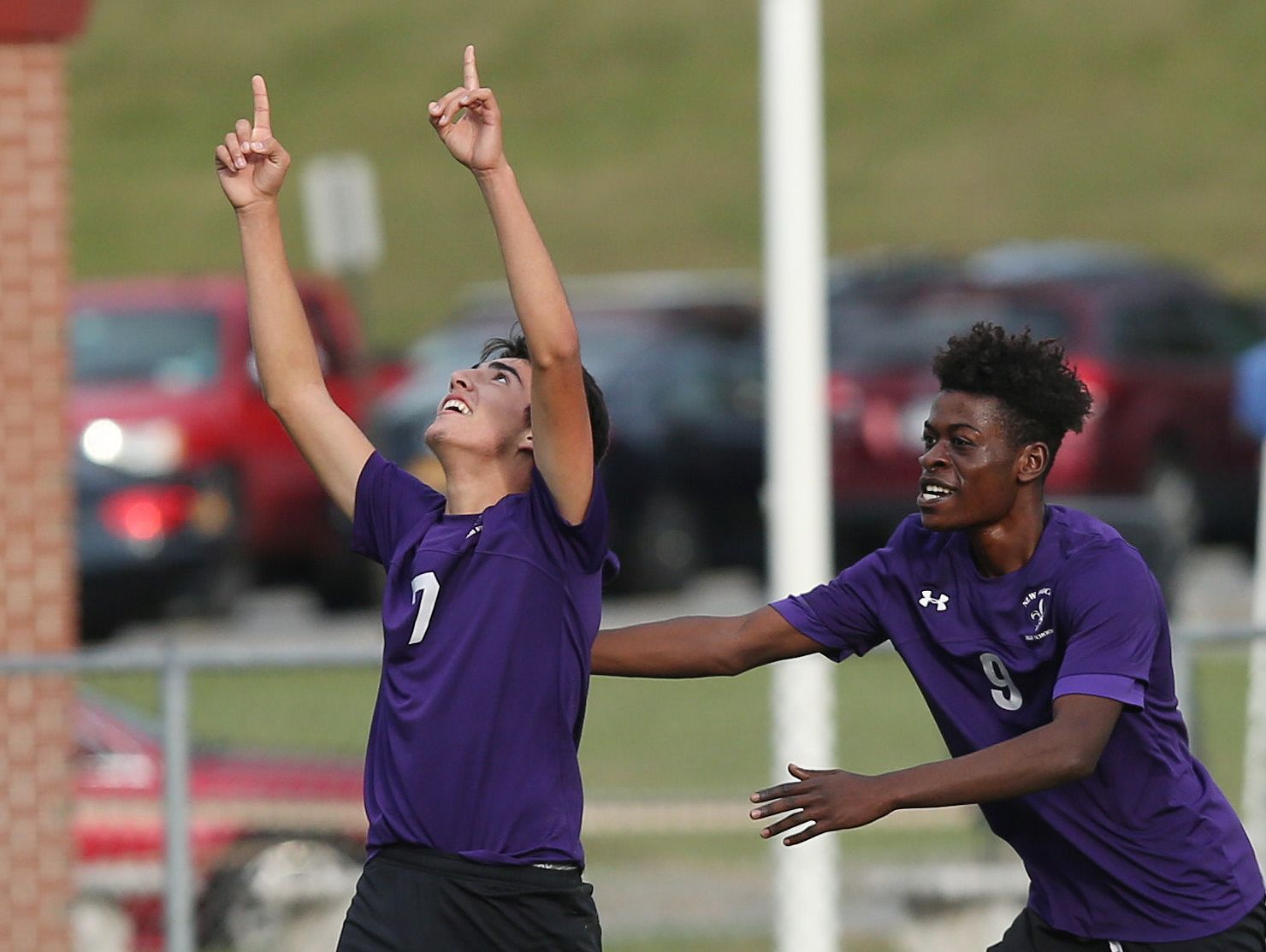 New Rochelle's Cristian Valencia (7) celebrates with teammate Stevenson Dievdonne (9) after his second goal of the first half against Arlington in the boys soccer Section 1 Class AA championship game at Lakeland High School in Shrub Oak High School Oct. 29, 2016. New Rochelle won the game 3-0.