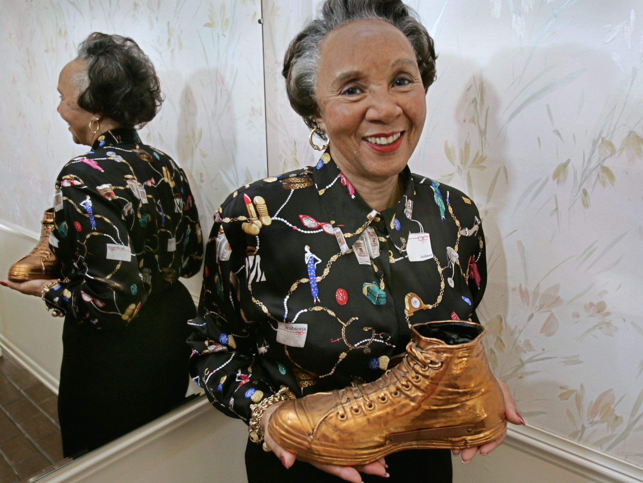 Betty Crowe was the wife of Ray Crowe when he coached Crispus Attucks to two state basketball titles in 1955 and 1956. Betty Crowe shows a piece of her Crispus Attucks basketball memorabilia, the brass-coated basketball shoe from former Attucks player, Oscar Robertson, who went on to great basketball fame.