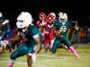 Dunbar High School's Keanu Young takes the ball up field during a game against Immokalee in Fort Myers, on Monday, Oct. 31, 2016.