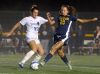 Victor's Lexi Perry, right, tries to block a clearance by Webster Schroeder's Nicole Ryan Wood.