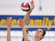 Webster's Chris McKrell hits past the block of Hilton's Zach Williams during a regular season game at Webster Schroeder High School on Thursday, Oct. 6, 2016. Webster beat Hilton 3-1 (25-23, 25-15, 18-25, 25-17)
