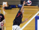 Hilton's Hunter Betrus takes a swing at the net.