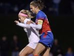 Victor’s Serena Uhl, left, defends against Fairport’s Claire Myers.