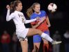 Victor’s Lexi Perry, left, challenges for the ball against Fairport’s Zoe Janes.