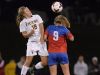 Victor's Samantha White, left, jumps for a header against Fairport’s Zoe Janes.