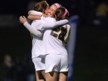 Victor’s Emily Leonard, facing center, celebrates the win with teammates Lexi Perry and Jojo Leonardo during a girls soccer game at Victor High School on Monday.