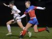 Victor’s Abby Richards, left, defends against Fairport’s Sinead Sargeant during a regular season soccer game at Victor High School on Monday. Victor beat Fairport 2-1.