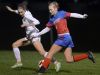 Victor’s Abby Richards, left, defends against Fairport’s Sinead Sargeant during a regular season soccer game at Victor High School on Monday. Victor beat Fairport 2-1.