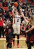 New Albany's Julyen Condra (2) fights to get her shot off under pressure from Brownstown Central High School's Brooklyn Snodgrass (2) during their game at New Albany High School in New Albany, Indiana. November 10, 2016