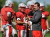 Canandaigua head coach Jeff Welch, right, calls to the sideline as he runs preseason football practice at Canandaigua Academy on Thursday, August 28, 2014.