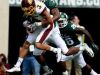 Central Michigan's Mark Chapman (3) with MSU's Demetrious Cox on his back during a game last season.
