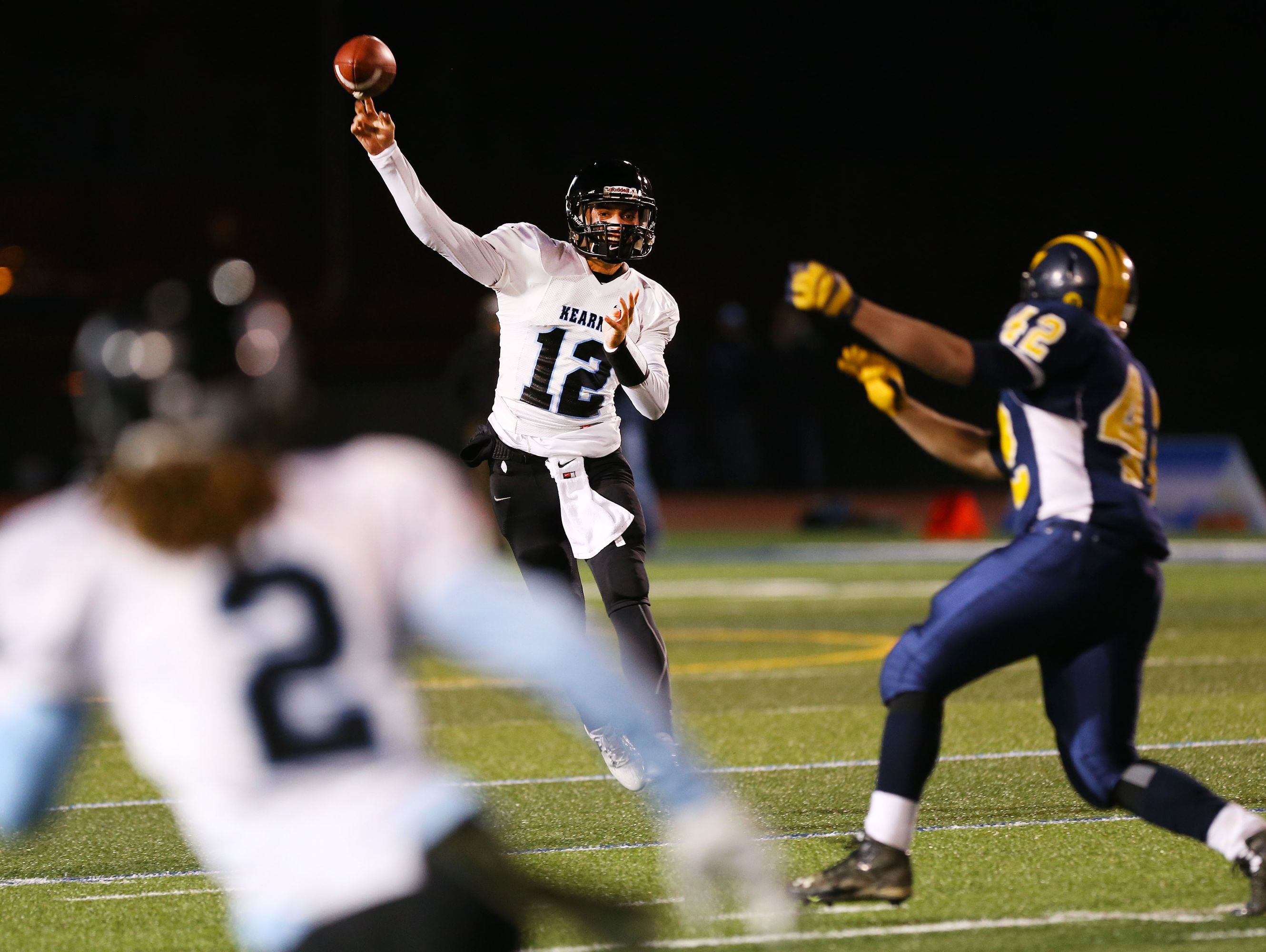 Bishop Kearney's Todd LaRocca,(12), throwing to Justin Davis during the Class D state semifinals at Cicero-North Syracuse, also ran for nine touchdowns this past season,